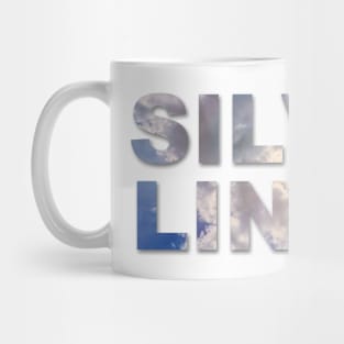 Silver Lining text with clouds and sun burst showing through the text. Mug